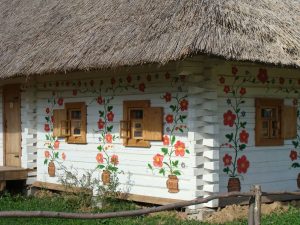White-washed hut with painted flowers small